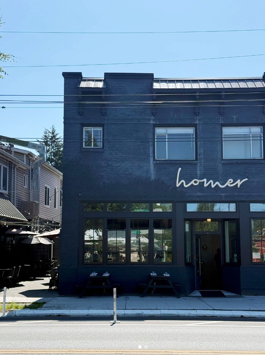 Homer’s blue storefront and outdoor tables on Beacon Hill in Seattle